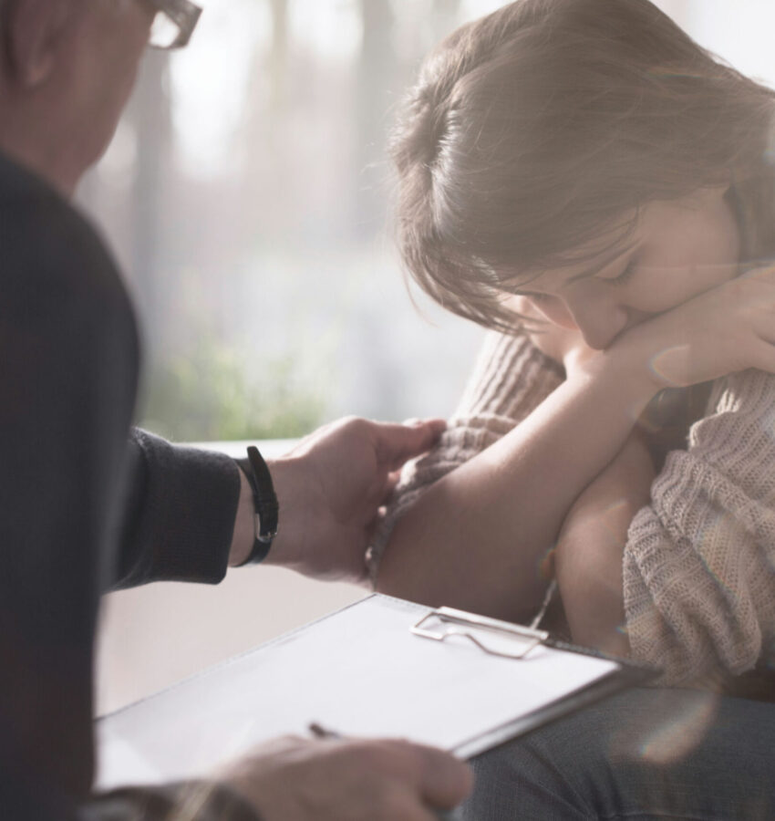 A therapist offers support through motivational interviewing in Los Angeles, helping a client explore personal struggles during a counseling session.